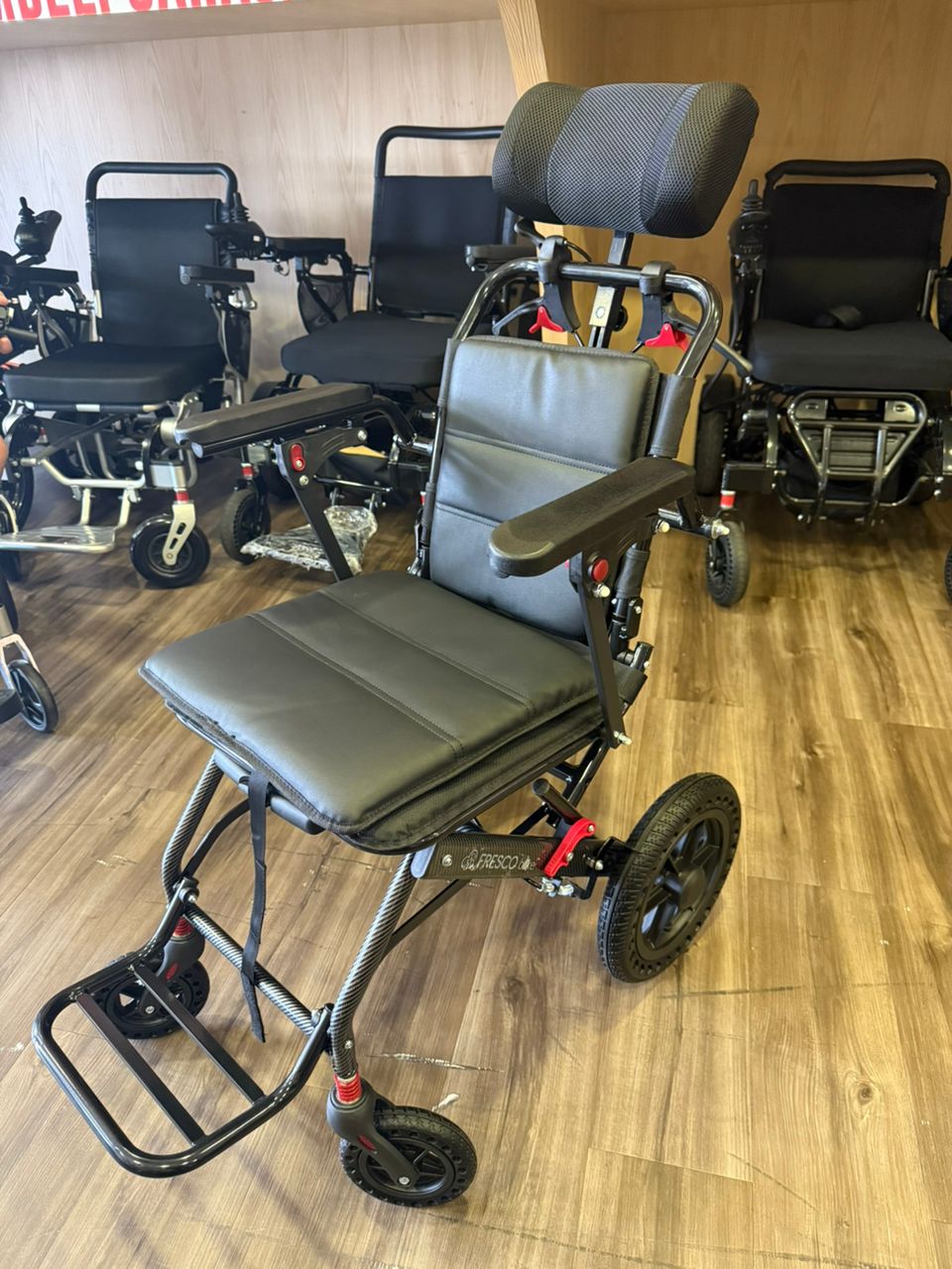 Fresco Bike travel wheelchair, lightweight and portable, with headrest. Ideal for elderly.