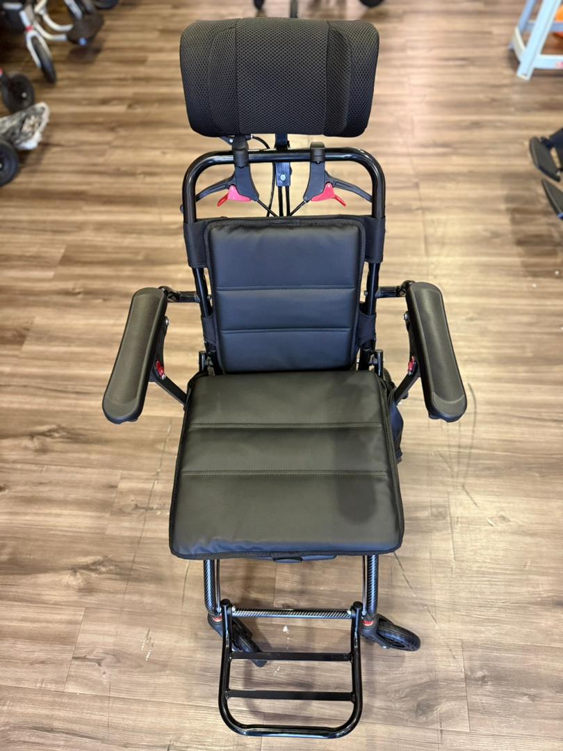 Fresco Bike travel wheelchair: lightweight, portable design with headrest and footrests.